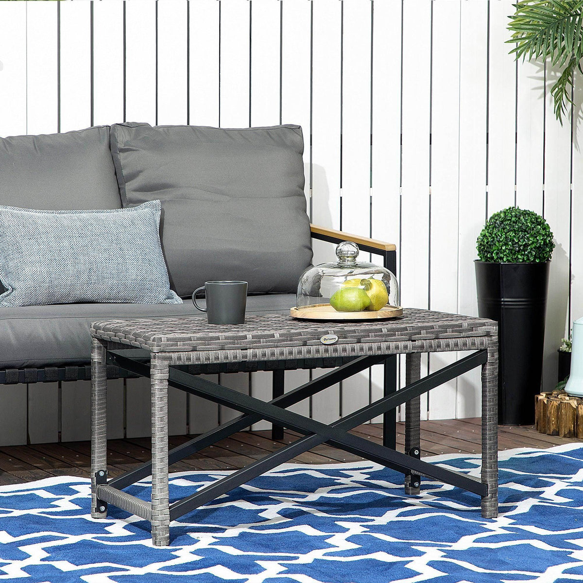 Gray woven outdoor coffee table with black metal X-frame legs and square top