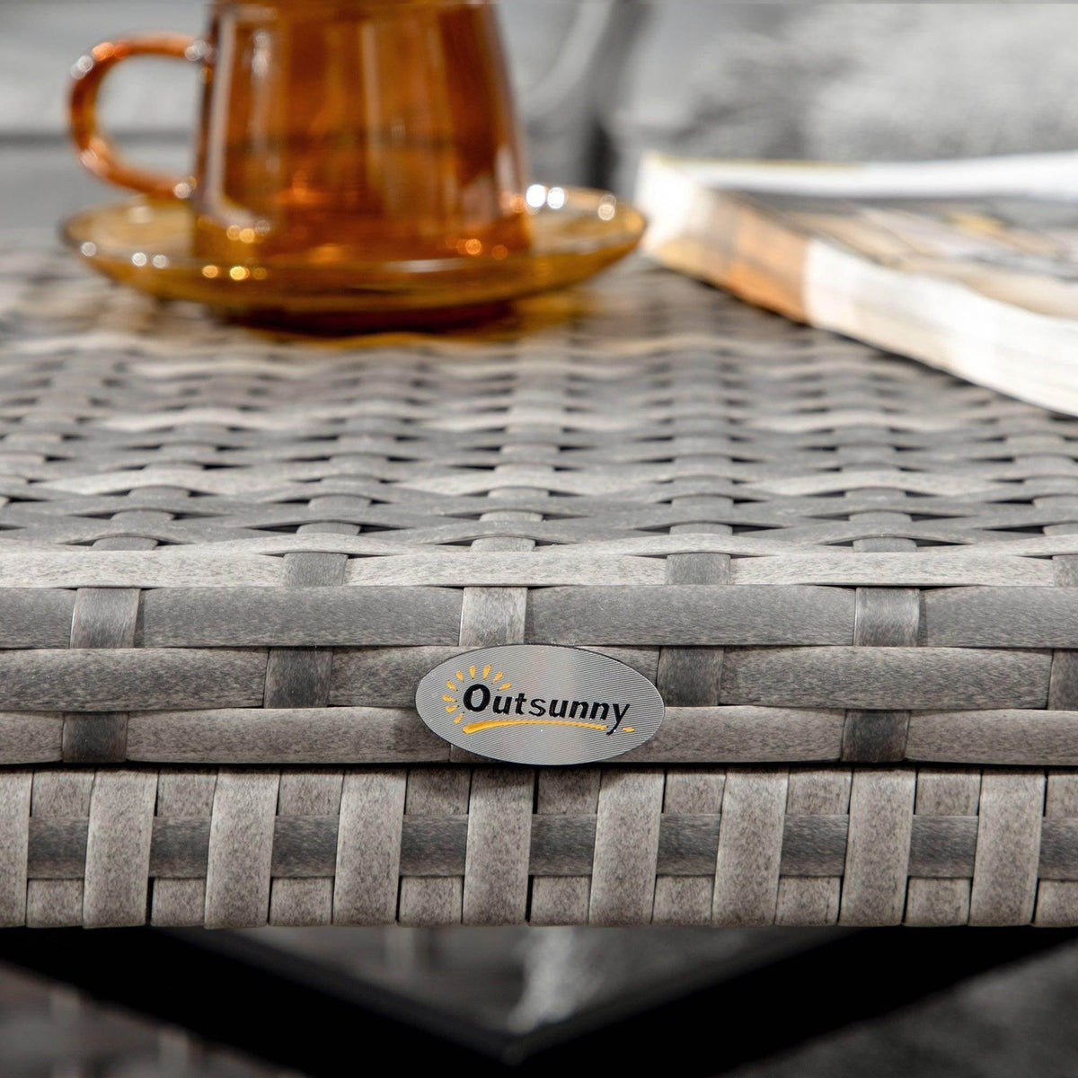 Gray wicker coffee table top with Outsunny oval label