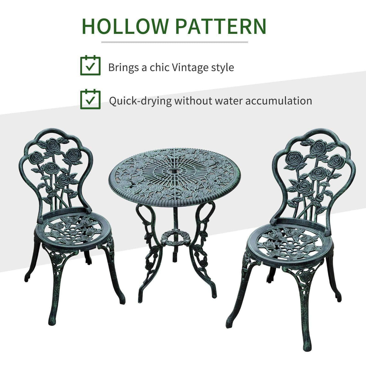 Round cast-metal bistro table and two decorative chairs with rose scrollwork