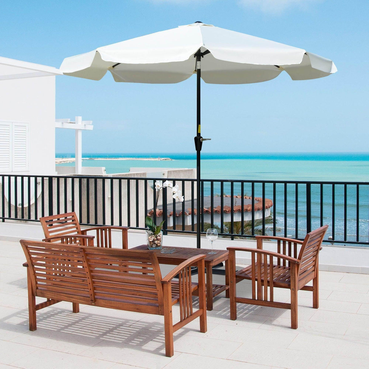Cream white ruffled patio umbrella with black pole and eight-rib open canopy