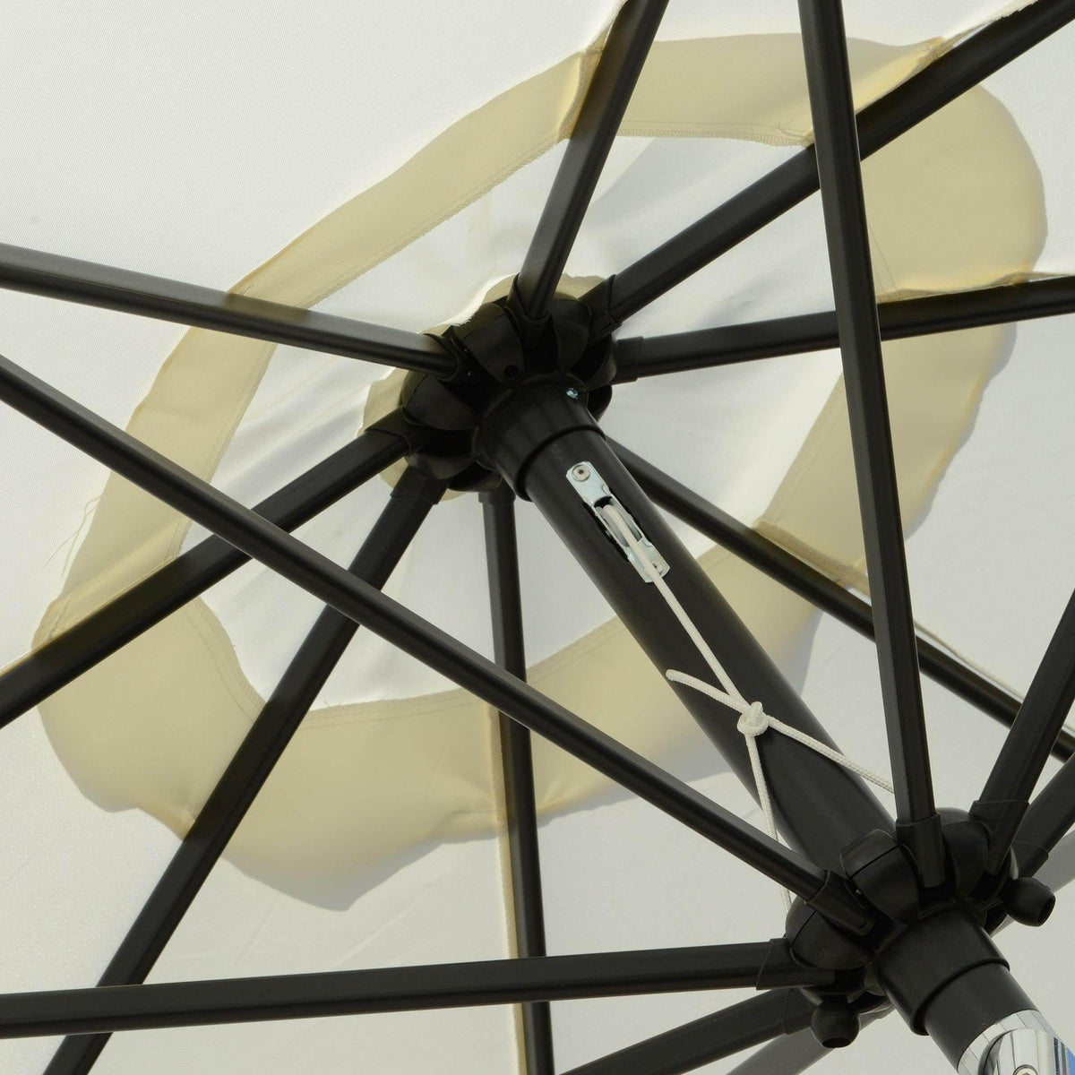 Cream white patio umbrella hub with black ribs and crank mechanism