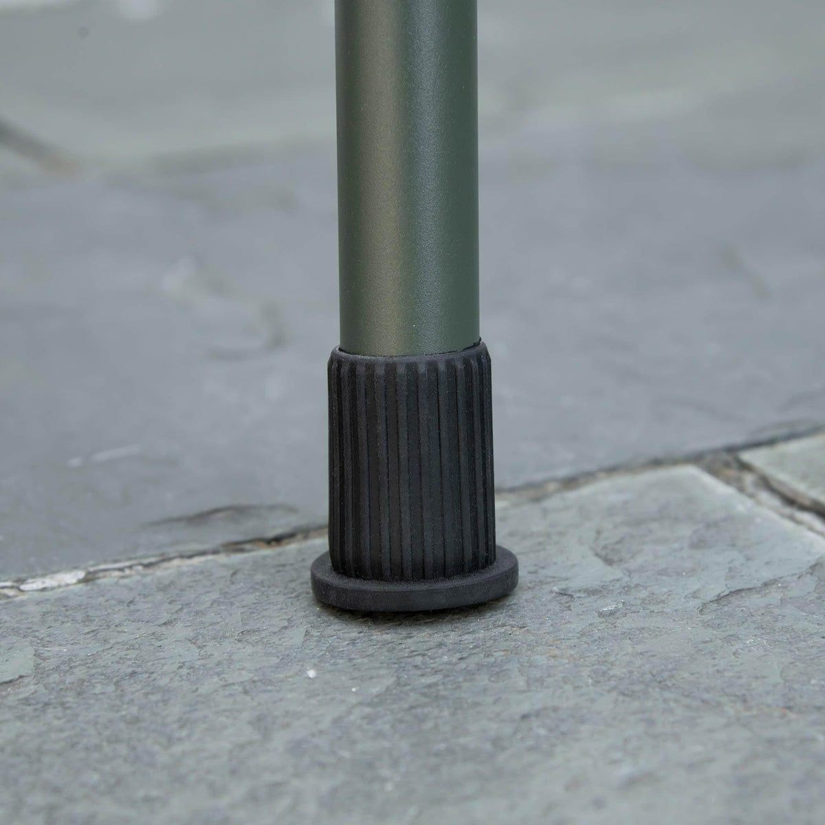 Charcoal BBQ grill leg foot cap close-up on the bottom of the leg