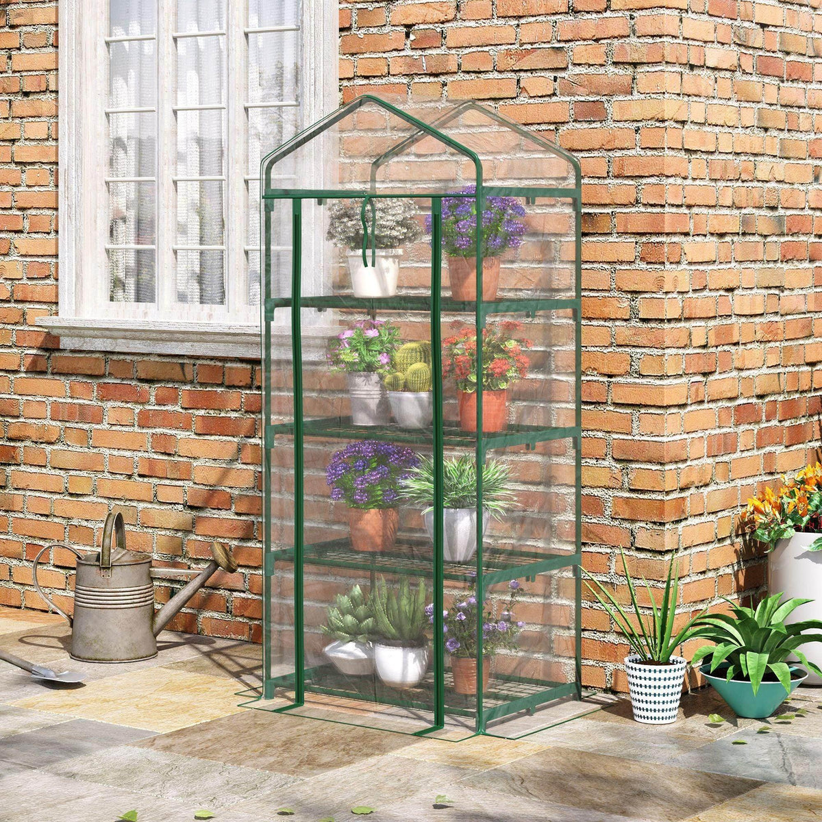 Portable mini greenhouse with green metal frame, clear cover, and 4-tier shelf for plants