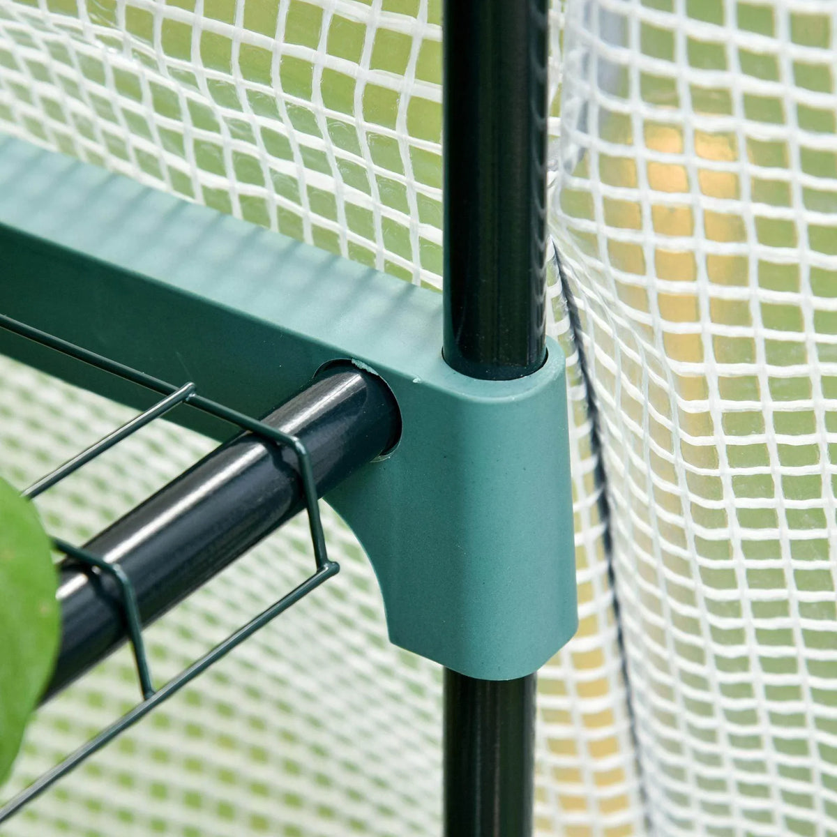 Green metal greenhouse post with black connection bracket, grid mesh panel