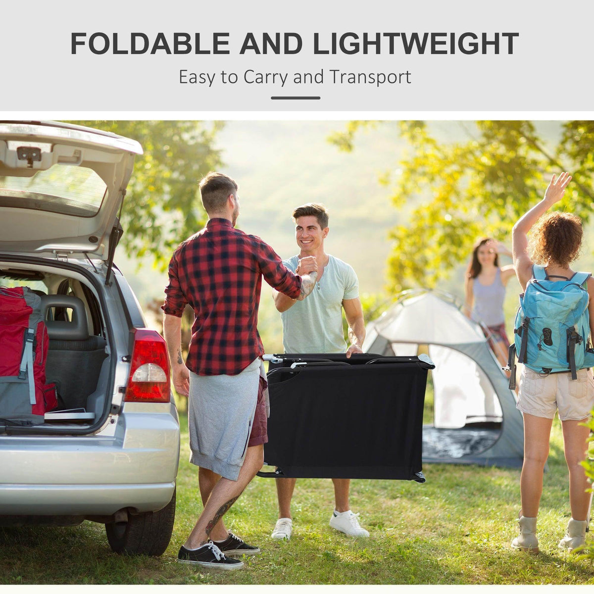 Black portable sun lounger being lifted from an open vehicle trunk