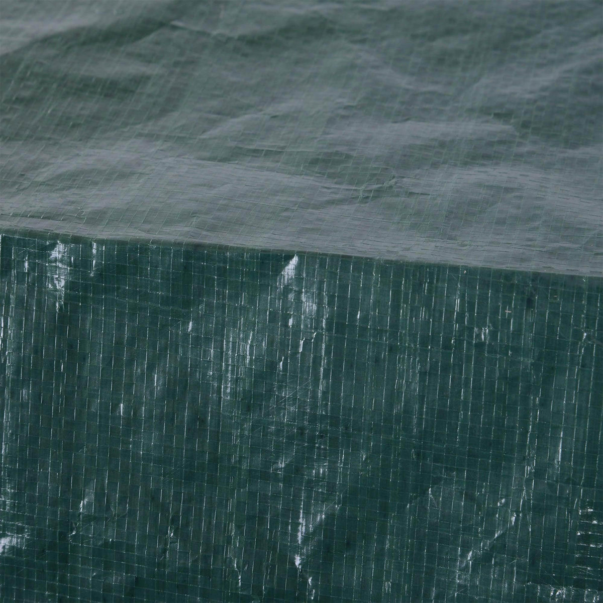 Close-up of dark green woven patio cover texture with waterproof surface sheen