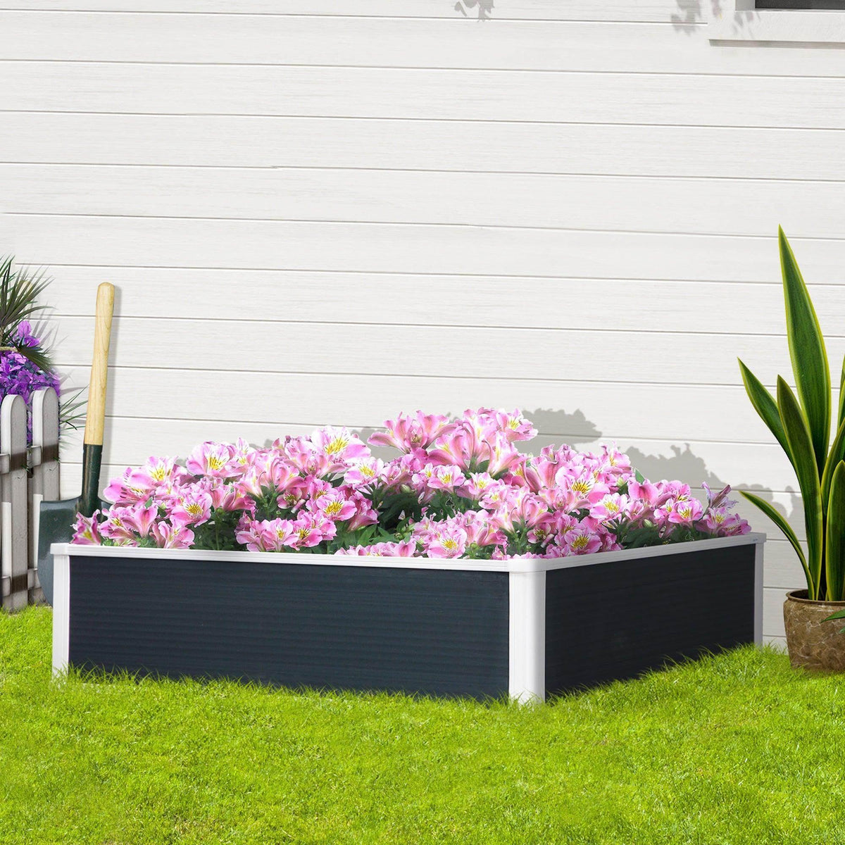 Raised garden bed planter with dark panels, white frame, filled with pink and purple flowers