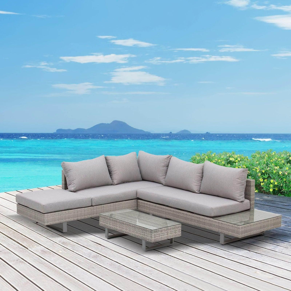 Rattan corner sofa set with light gray cushions and two rectangular coffee tables