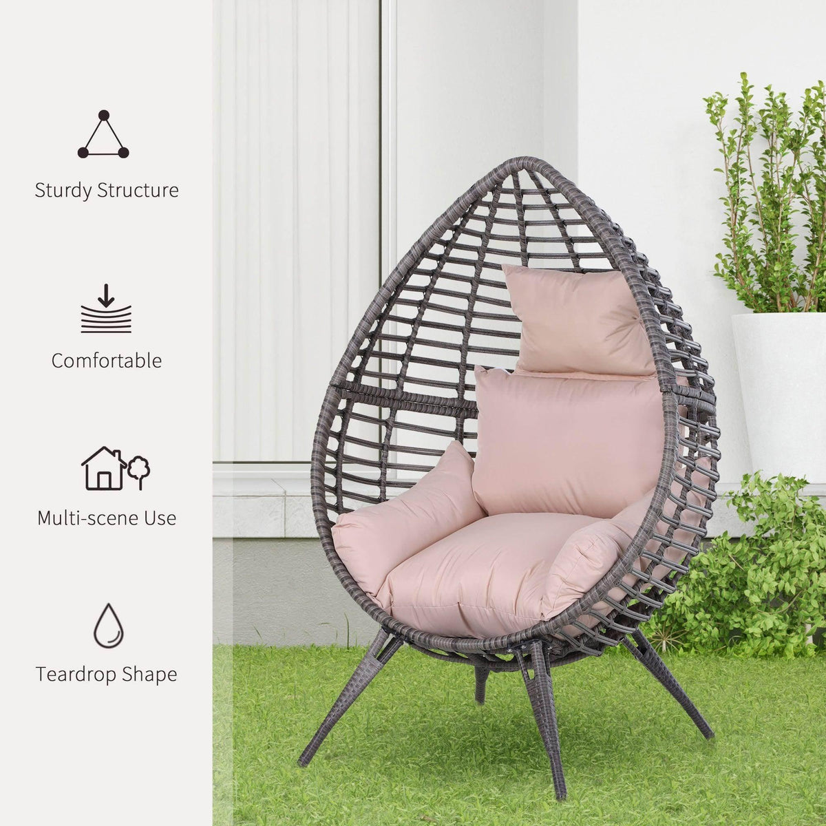 Teardrop rattan egg chair with light pink seat and back cushions, dark woven shell