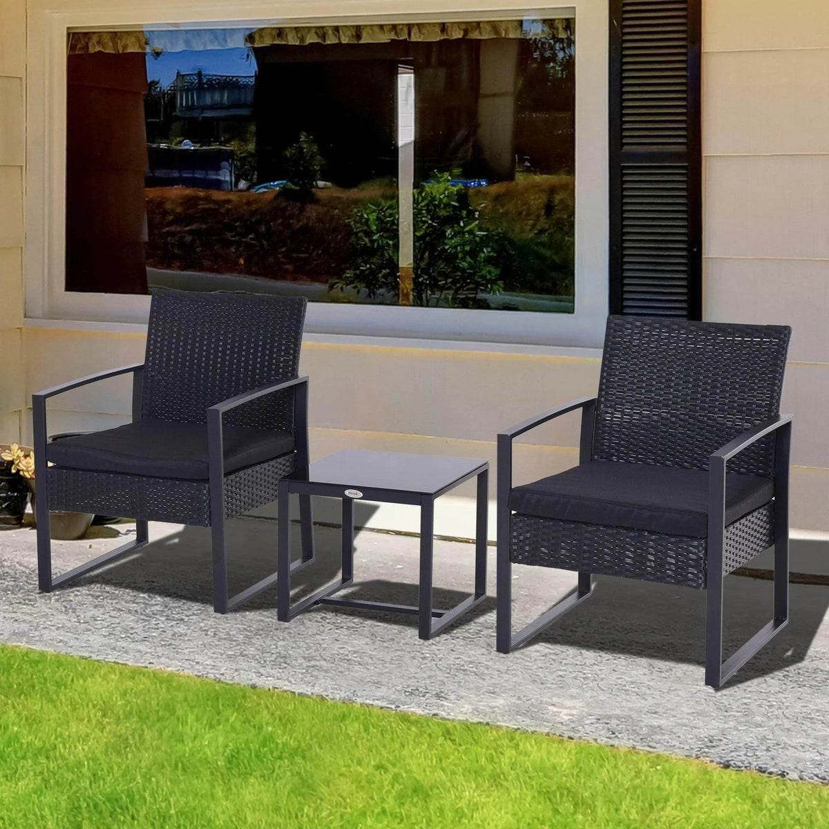 Black rattan patio bistro set with two armchairs and a square glass-top table