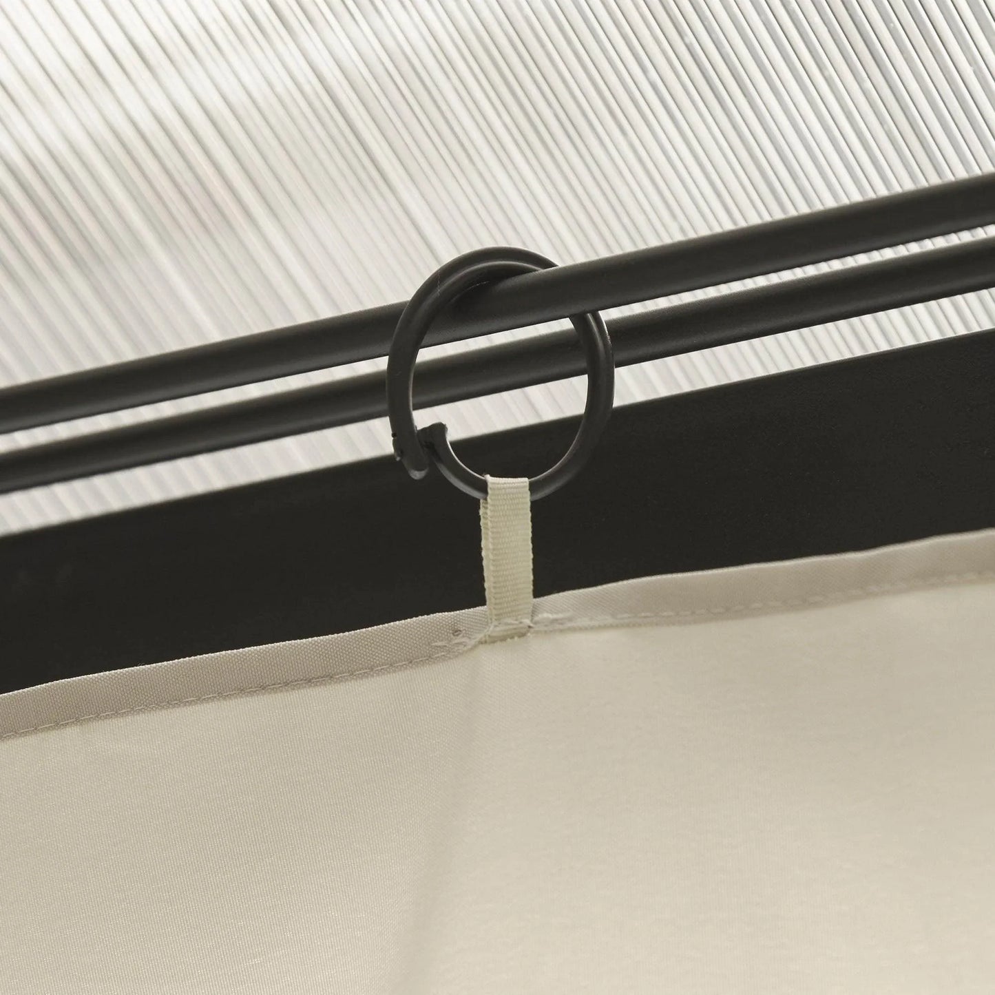 Beige sidewall top seam with black C-ring and hanging loop for rail attachment