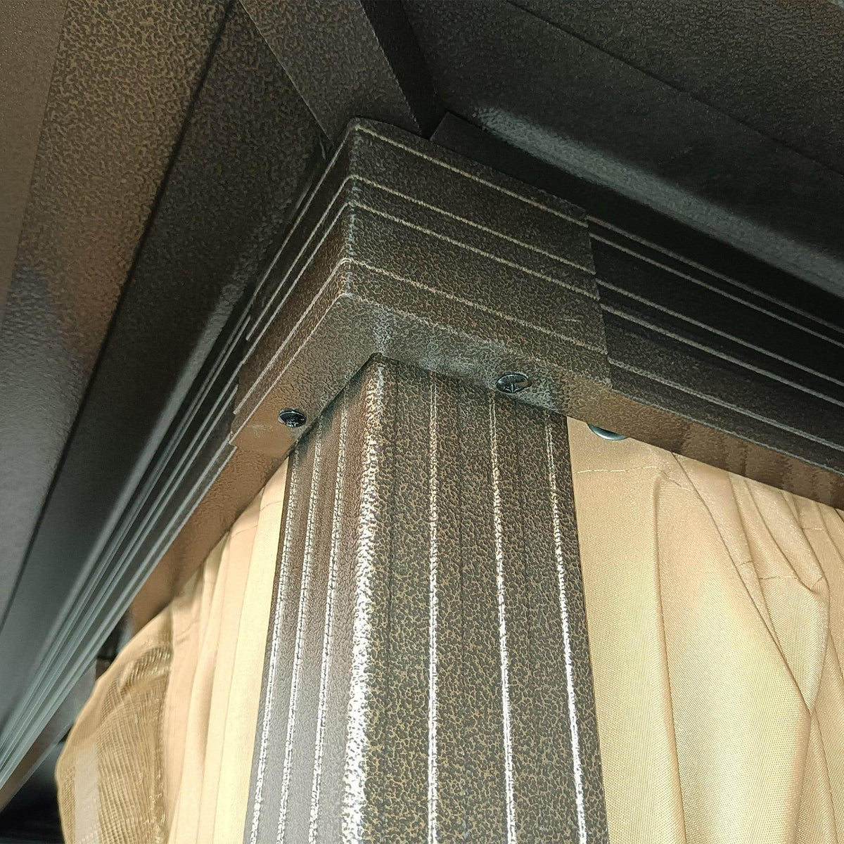 Hardtop gazebo corner with curtain top hanging hook and beige fabric curtain panel