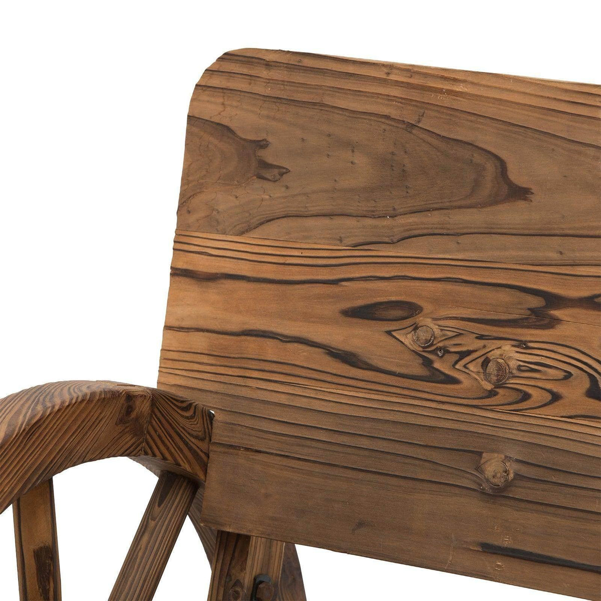 Close-up of wooden garden bench backrest with carved swirling wood grain