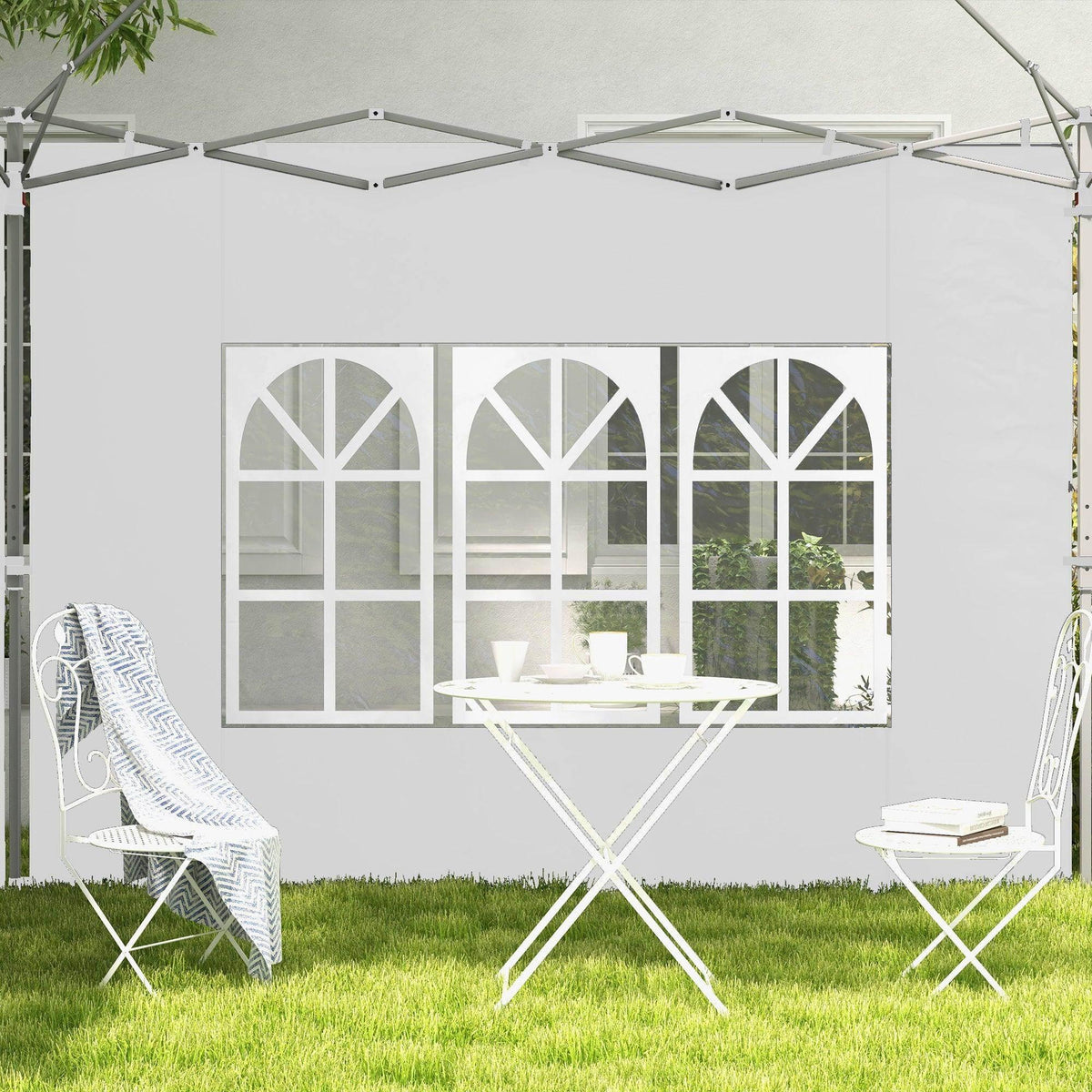 White gazebo side panel with grid windows; outdoor bench and table shown behind it