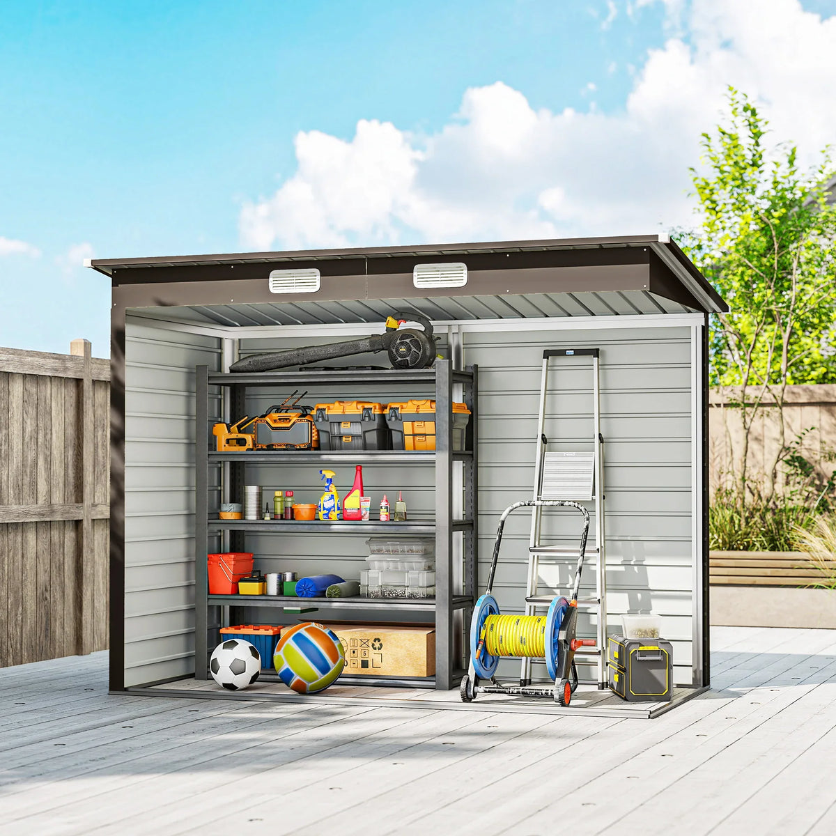 Galvanized steel storage shed with open doors, ladder, and tool accessories inside