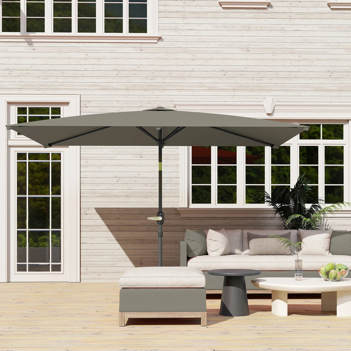 Rectangular patio parasol with light grey canopy above outdoor sofa seating