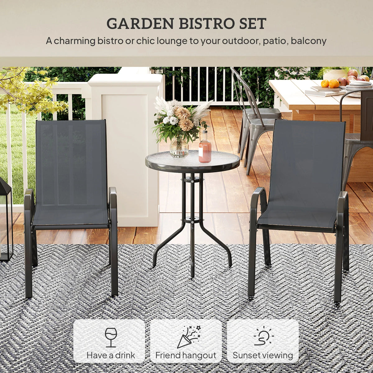 Outdoor bistro set with round glass-top table and four stackable grey patio chairs