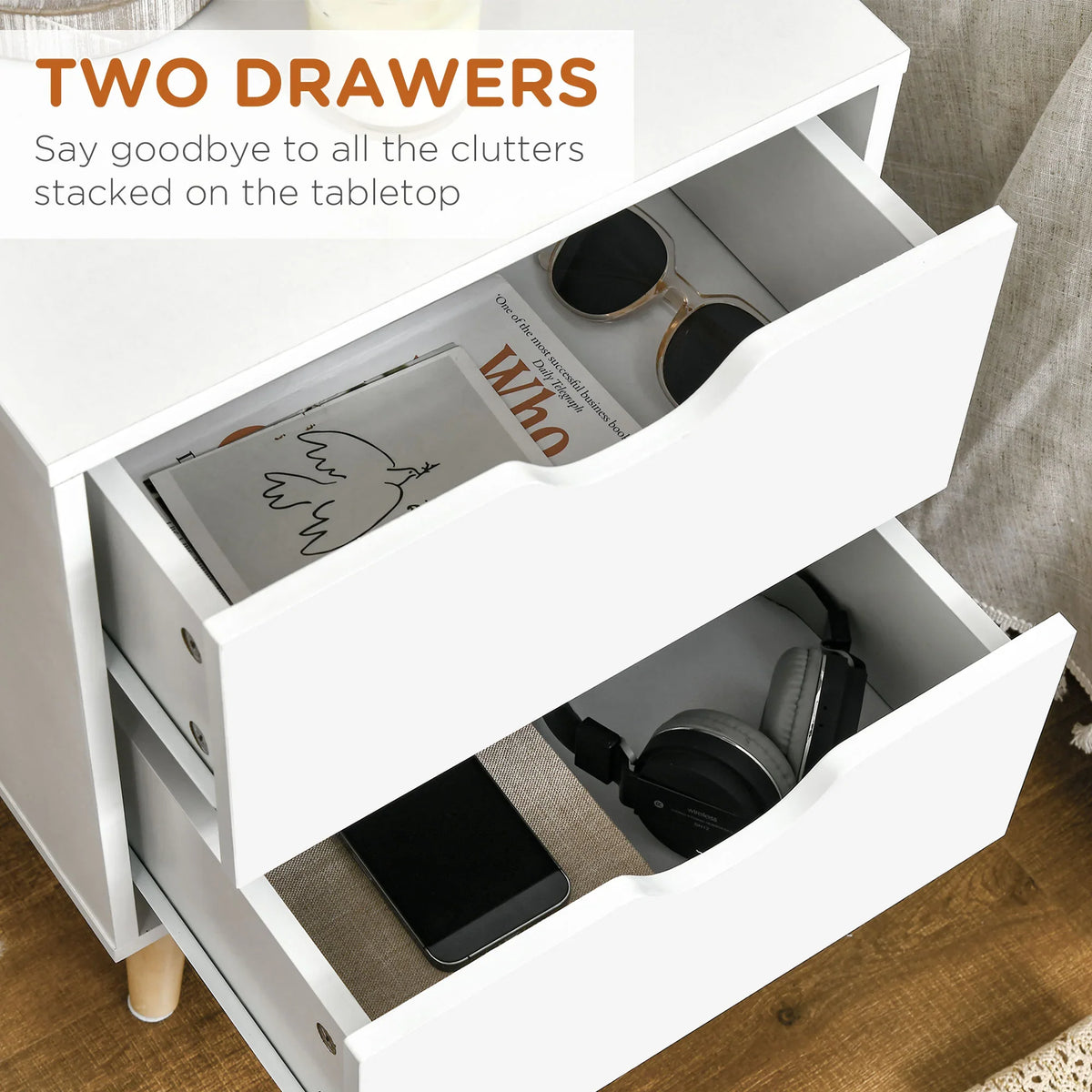 White bedside table with two open drawers showing storage compartments and black curved pulls.