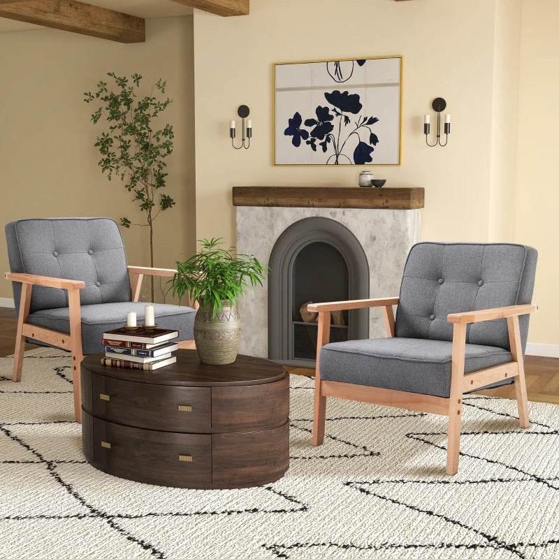 Set of 2 grey linen-look accent chairs with beech wood arms and tufted back, in room.