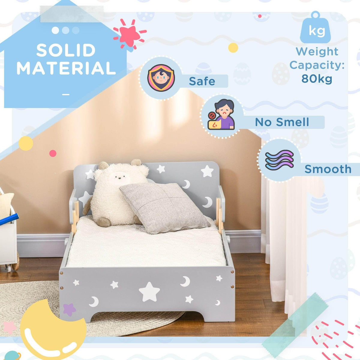 Grey toddler bed with star-moon paneling, mattress and pillows, wooden slats