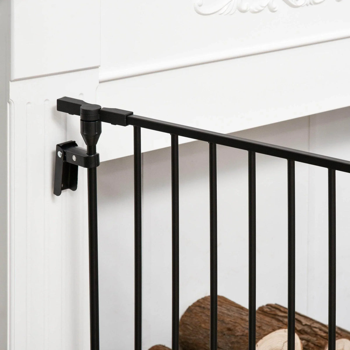 Wall-mounted bracket and top rail of black 3-panel pet safety gate