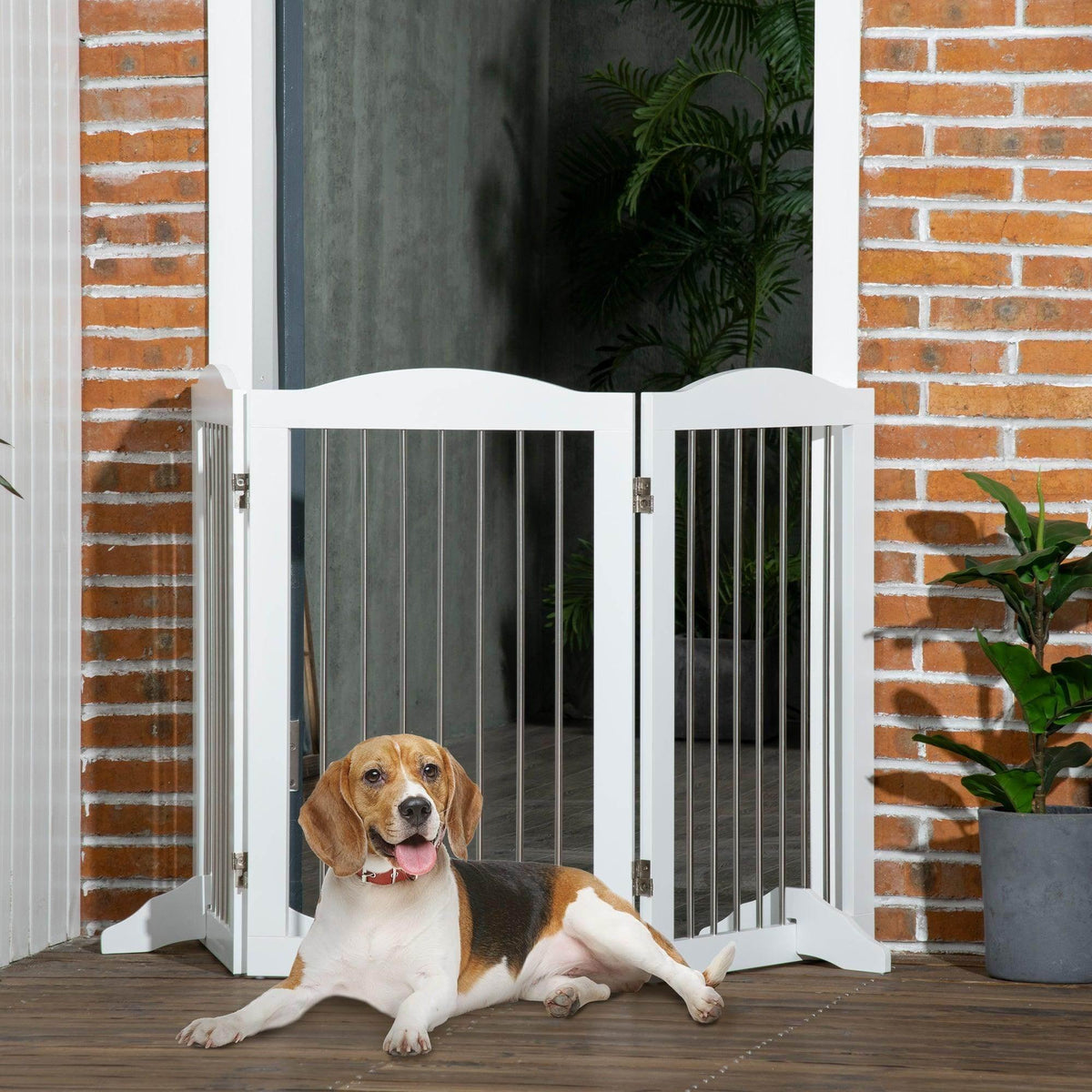White foldable dog gate with vertical bars, shown in doorway with small dog.