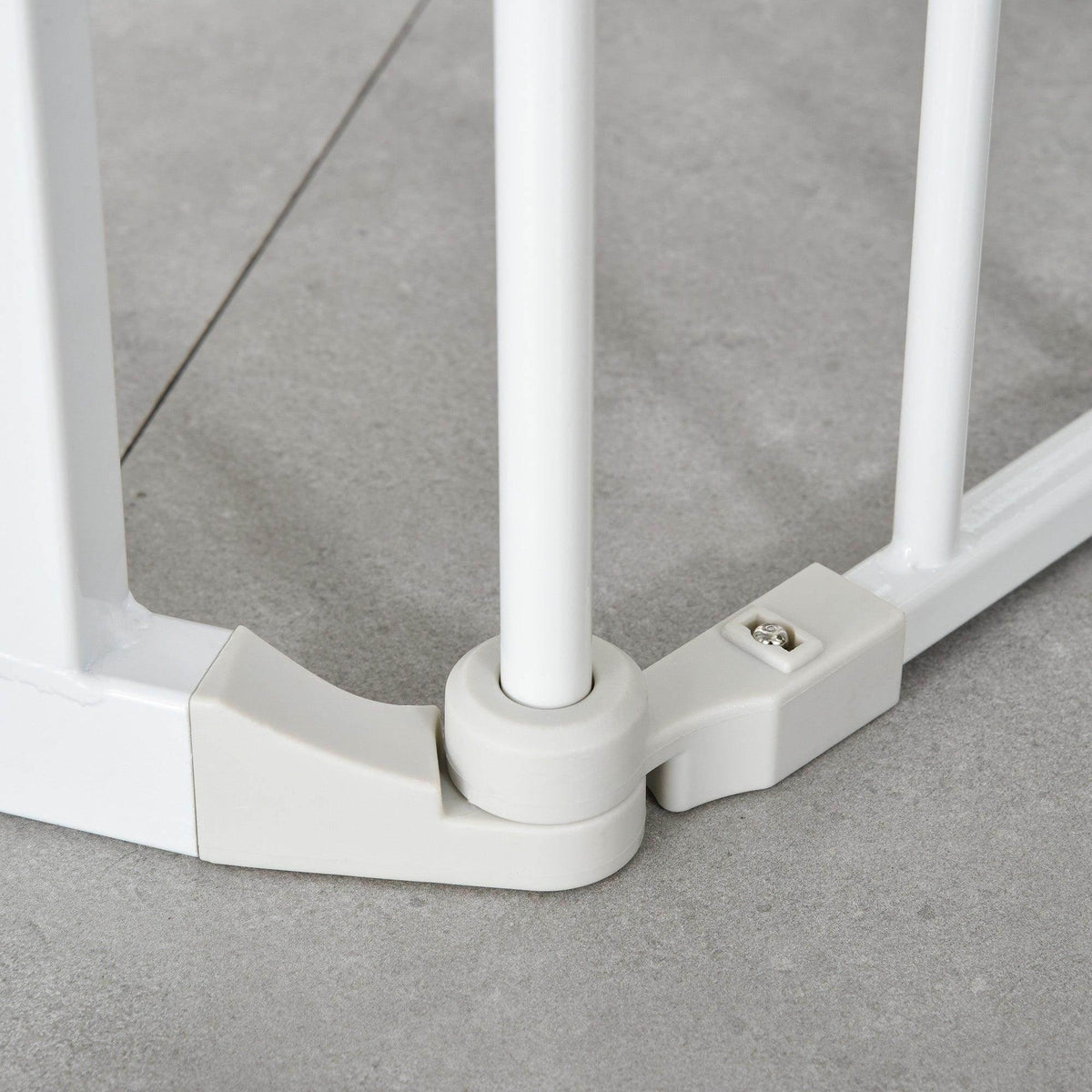 White pet safety gate base with locking foot and support post on floor