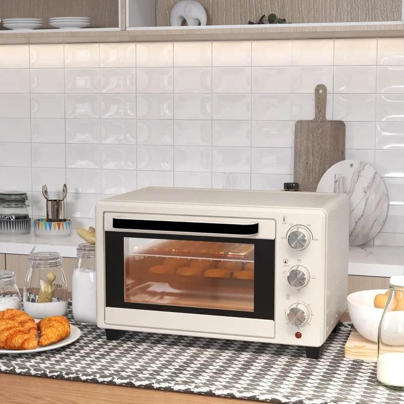 Cream countertop electric oven with glass door and control knobs on the right