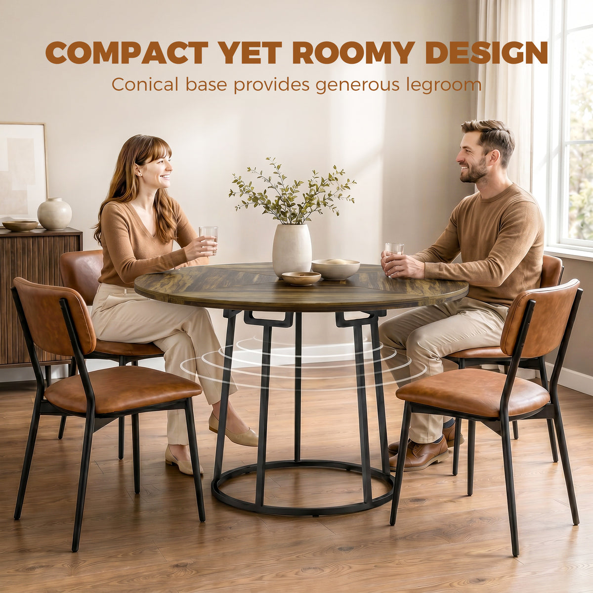 Round rustic brown dining table with black conical base and four wooden chairs