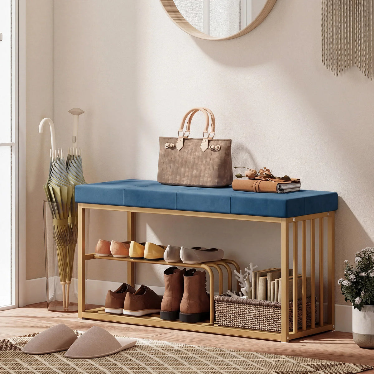 Dark blue tufted velvet shoe storage bench with gold-tone steel frame, two-tier rack