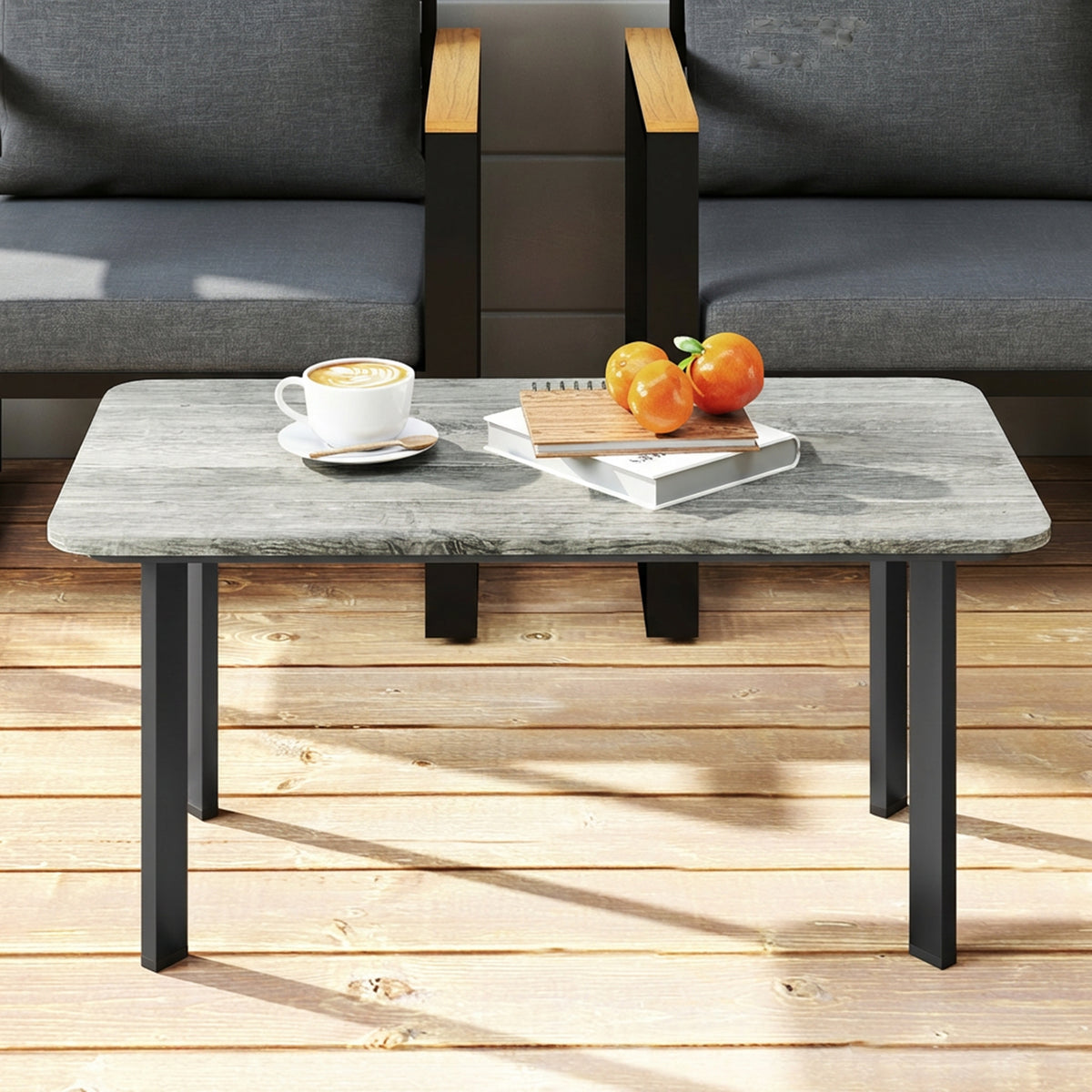 Grey outdoor coffee table with slatted tabletop and black metal legs