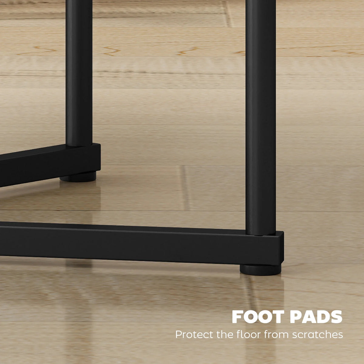 Round nesting table leg with protective foot pad, black metal frame.