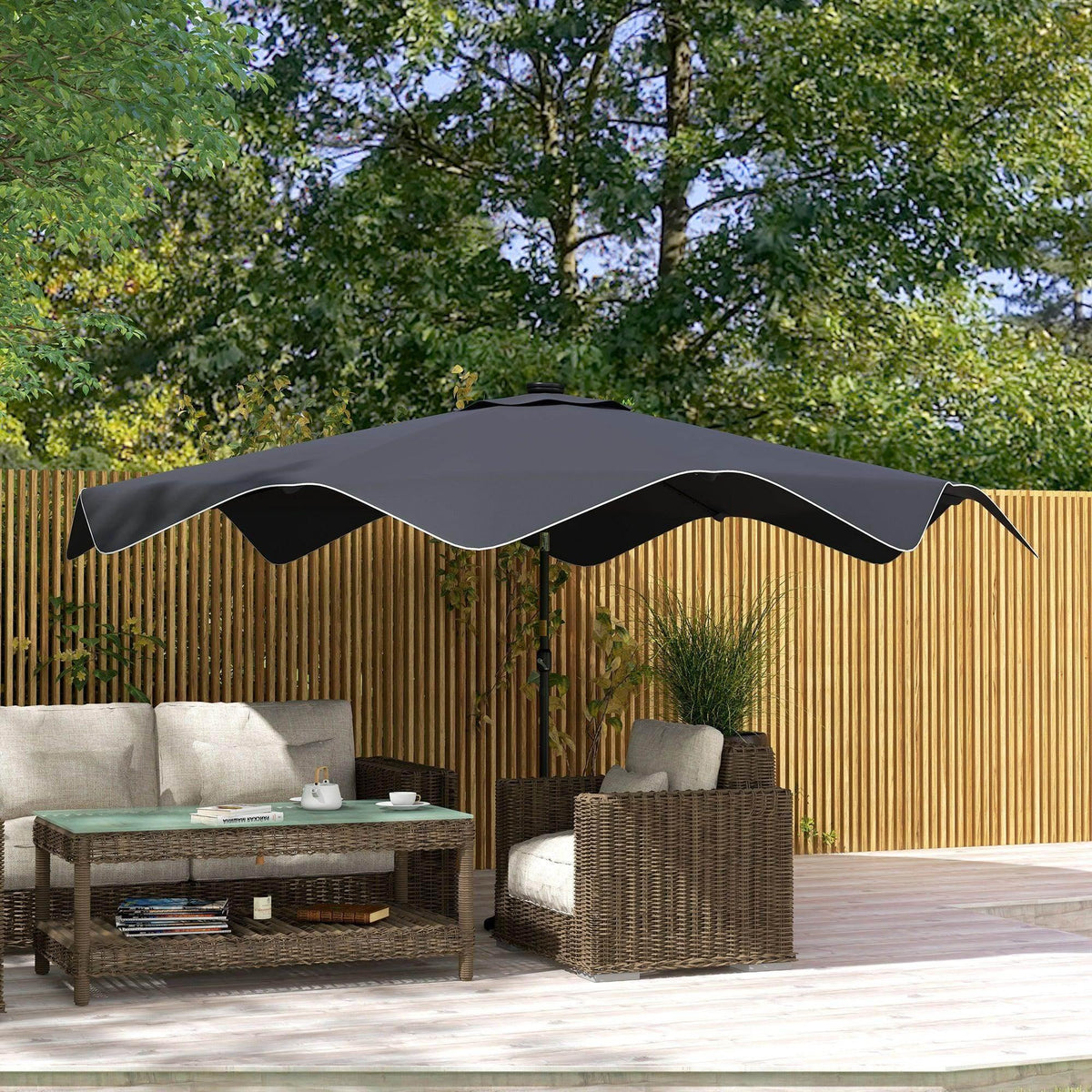 Dark grey patio market umbrella with open canopy and central pole over outdoor seating