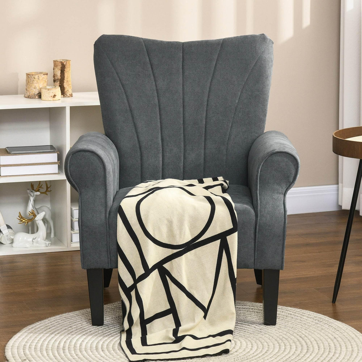 Grey high-back accent armchair with rolled arms and dark wooden legs