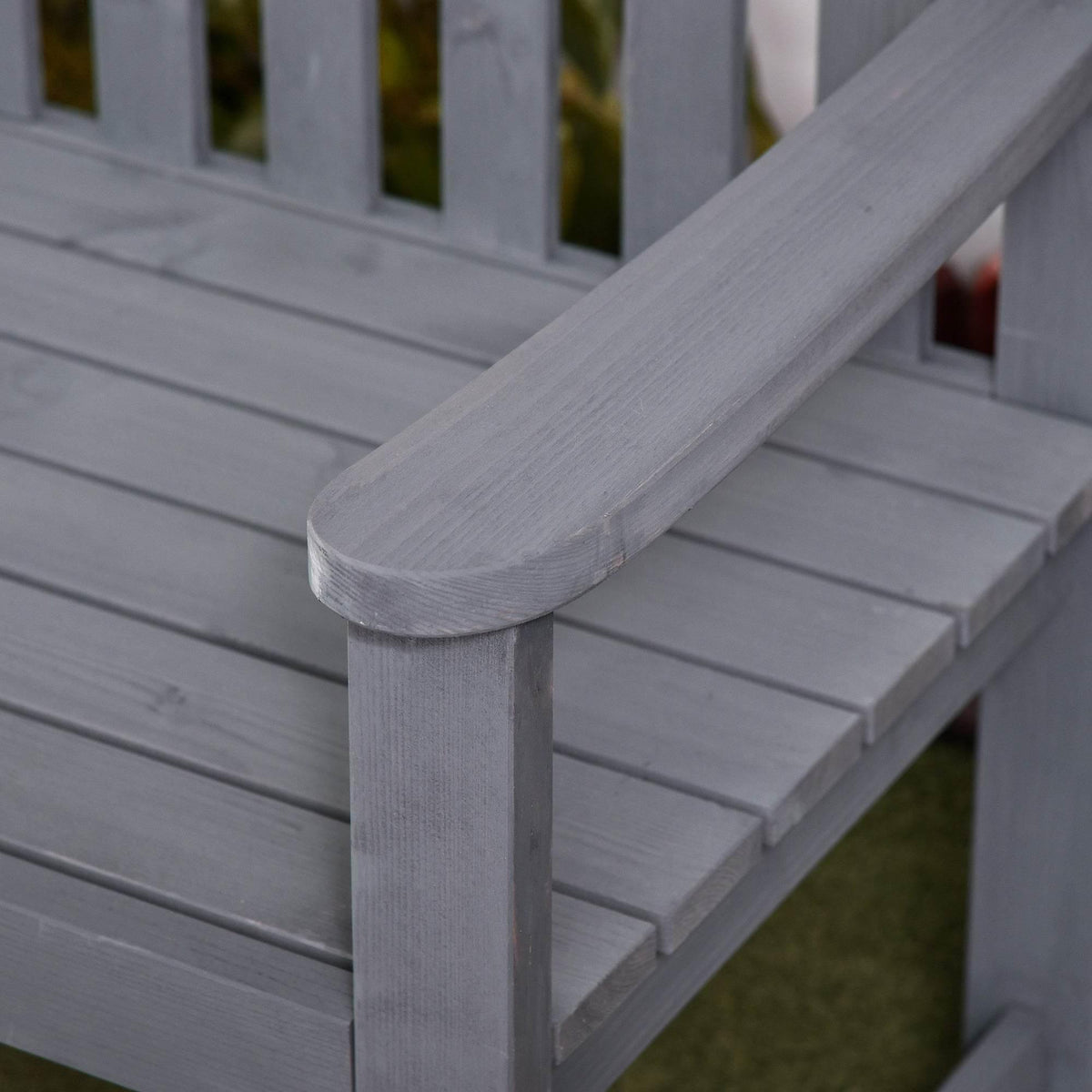 Grey fir wood bench seat and armrest detail with rounded corner