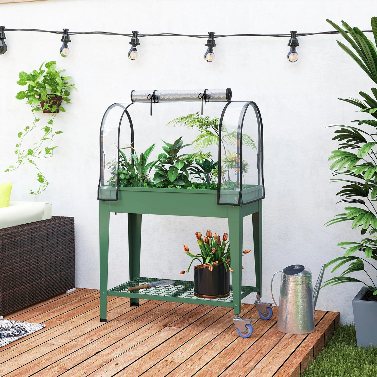 Green mobile raised garden bed with greenhouse cover, pots, and string lights