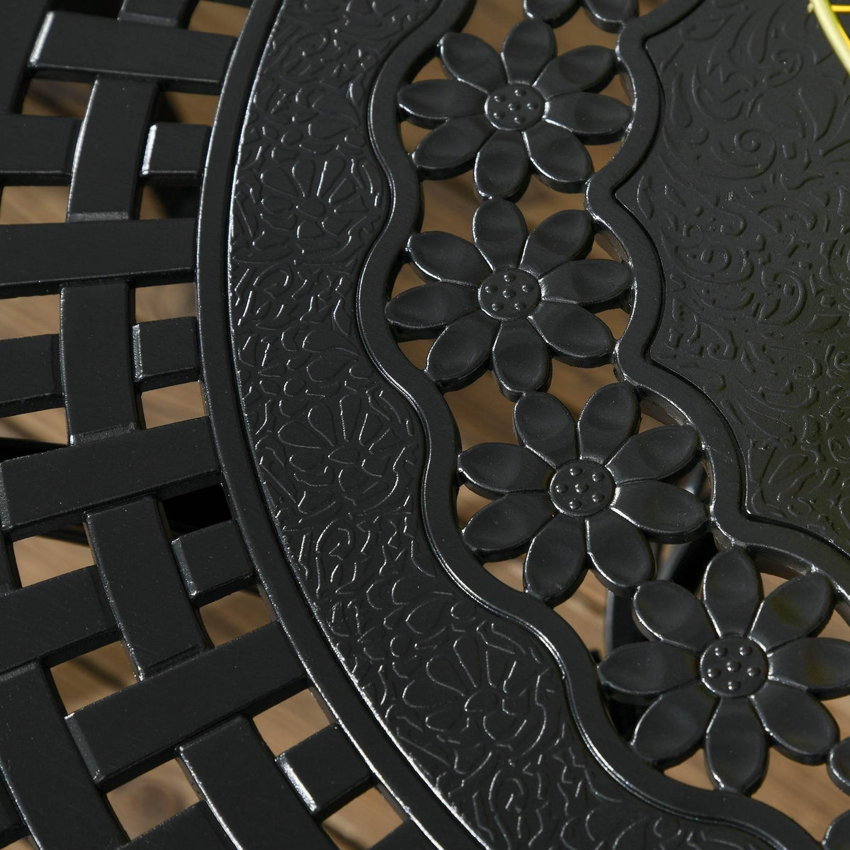 Black cast-aluminum table base with floral cutout design