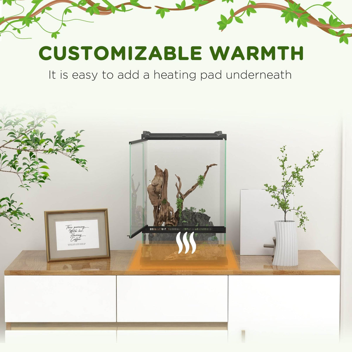 Glass reptile terrarium with black frame showing an under-heating setup beneath