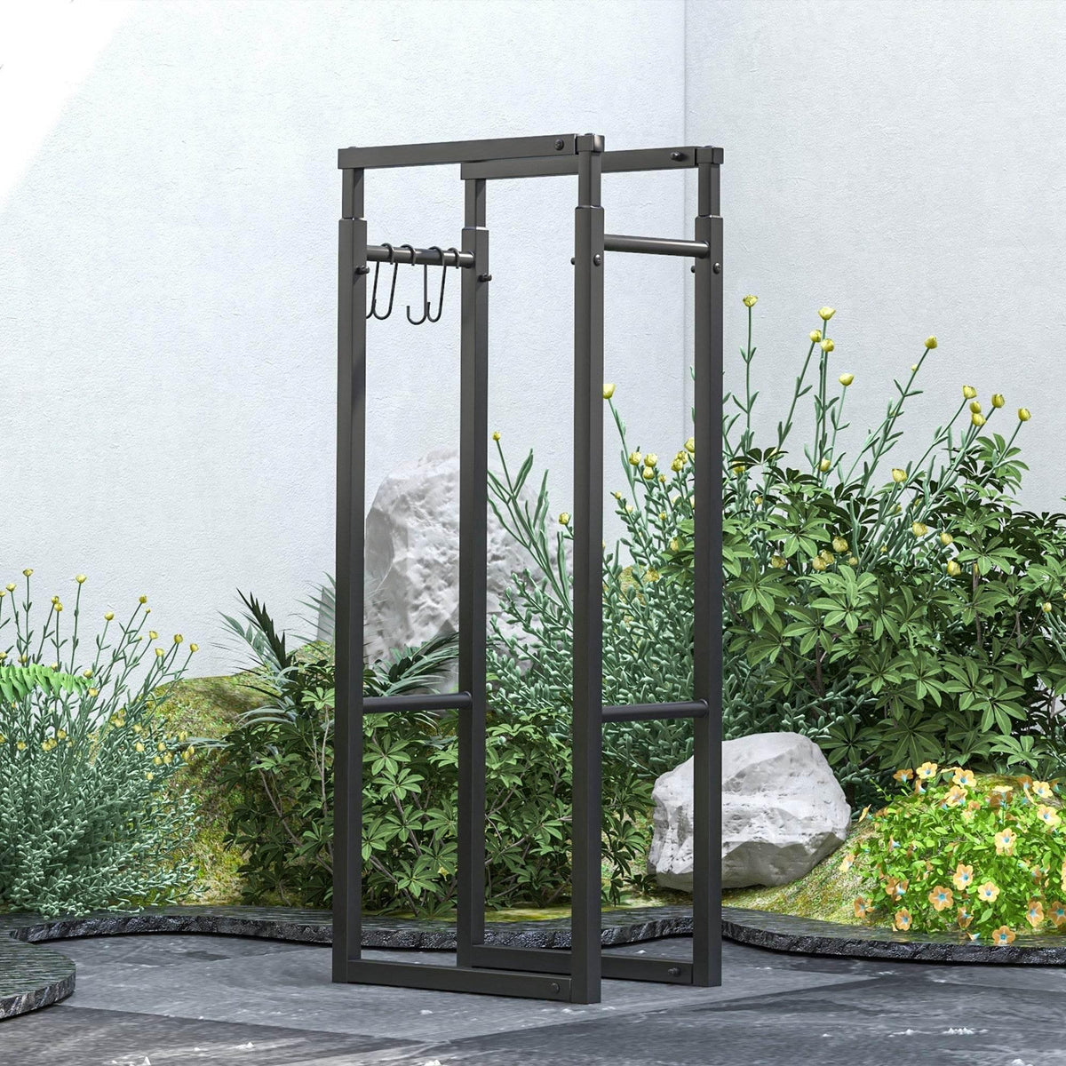 Black metal firewood log rack standing in a garden yard with hook panel