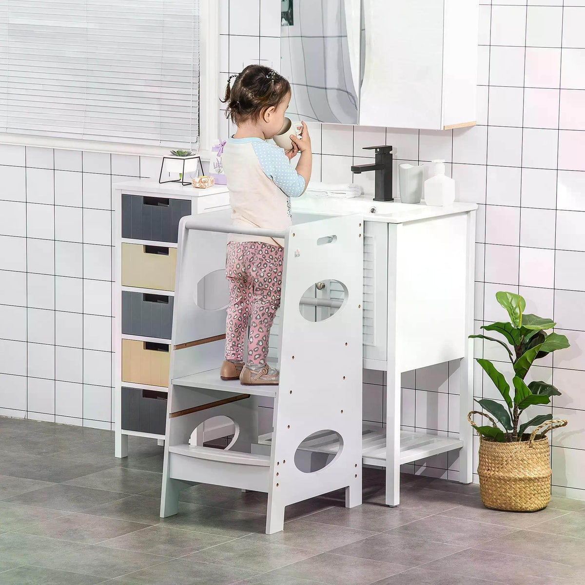 Grey adjustable kids step stool with safety rail, two steps and rounded cutouts