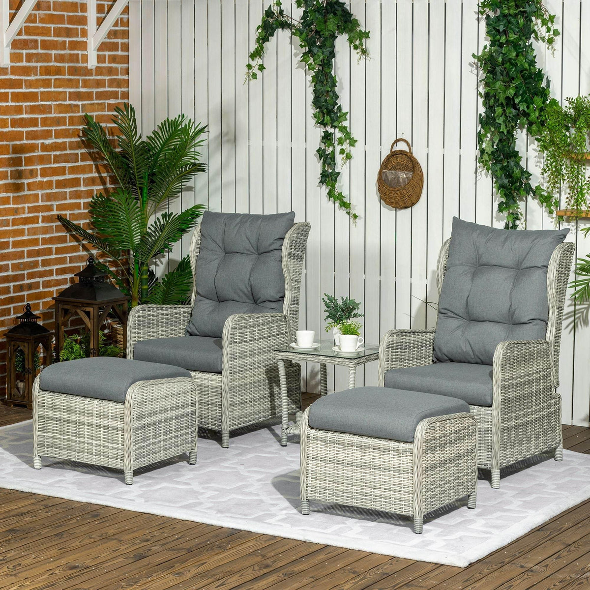 Outdoor wicker recliner set with two chairs and glass-top side table