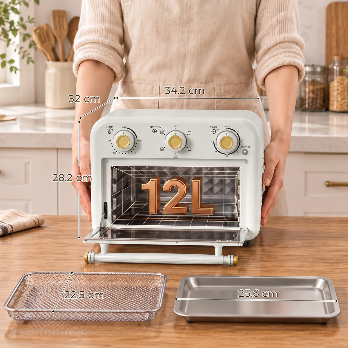 Cream HOMCOM 12L air fryer toaster oven with three knobs and accessories on counter