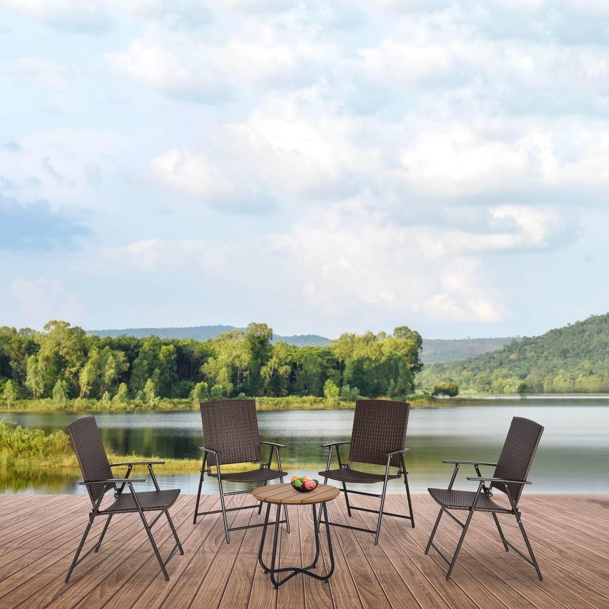 Set of 4 foldable rattan patio chairs with dark woven backs on outdoor deck