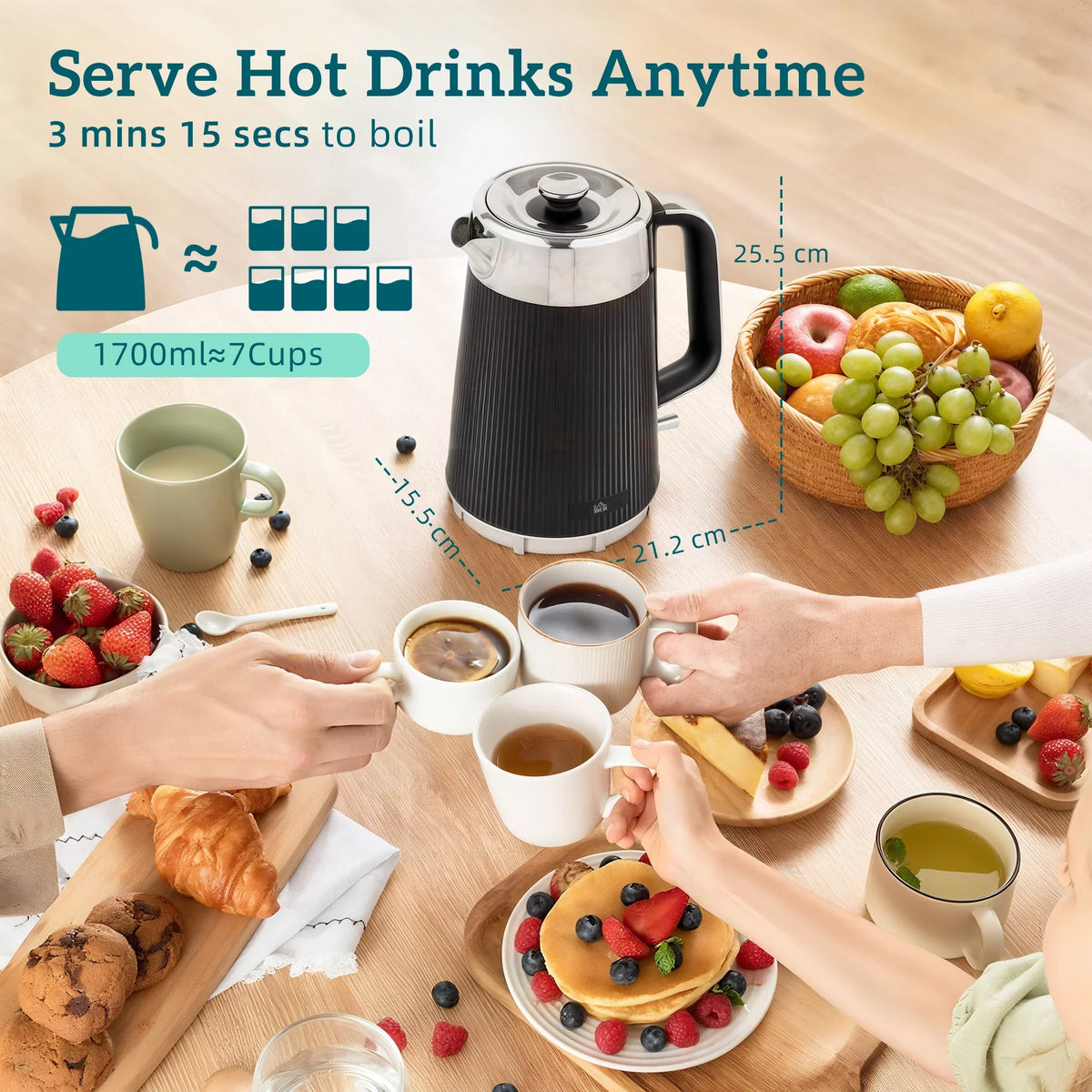 Black electric kettle with cups and toast on a tabletop serving setup
