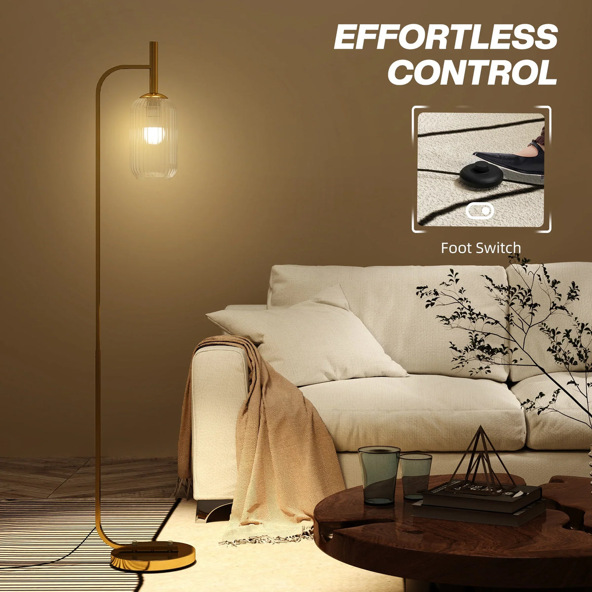 Gold LED floor lamp with clear glass shade and round base with foot switch