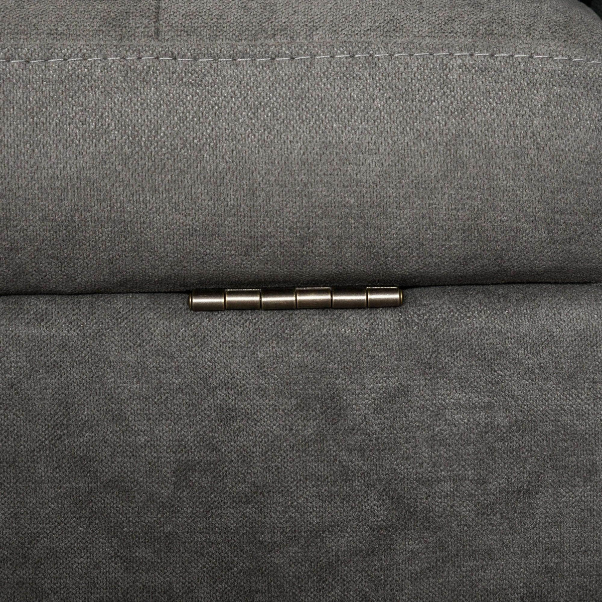 Grey sofa storage latch/handle bar on upholstered panel.