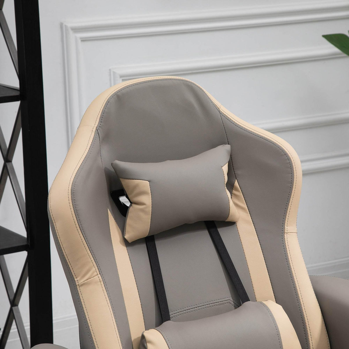 Grey recliner backrest with adjustable headrest cushion and beige trim piping.