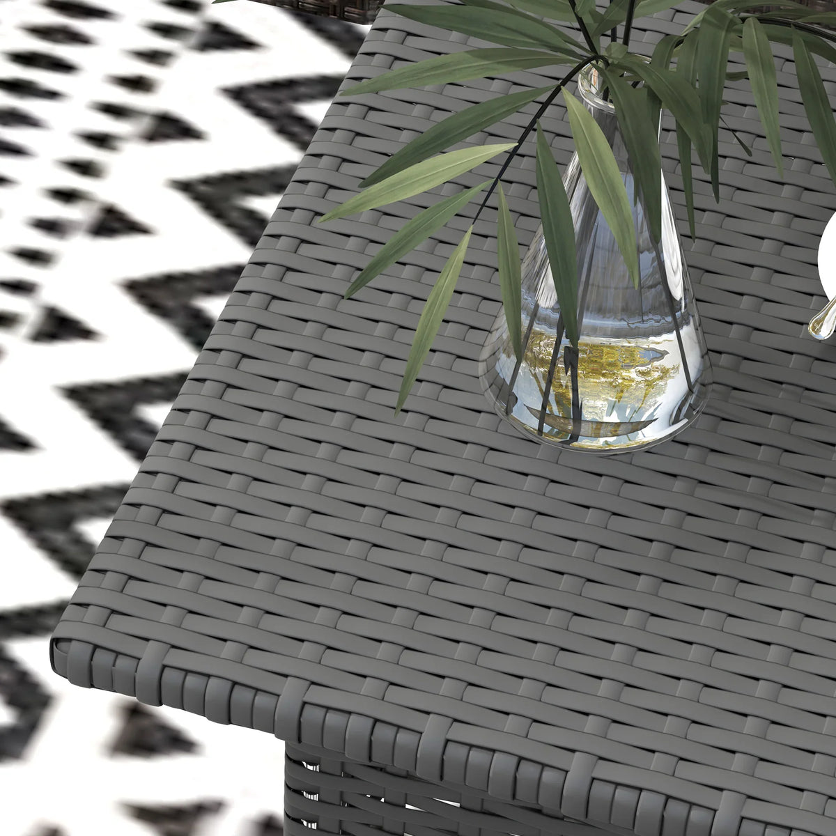 Grey woven tabletop edge detail with curved corner and overhanging rim