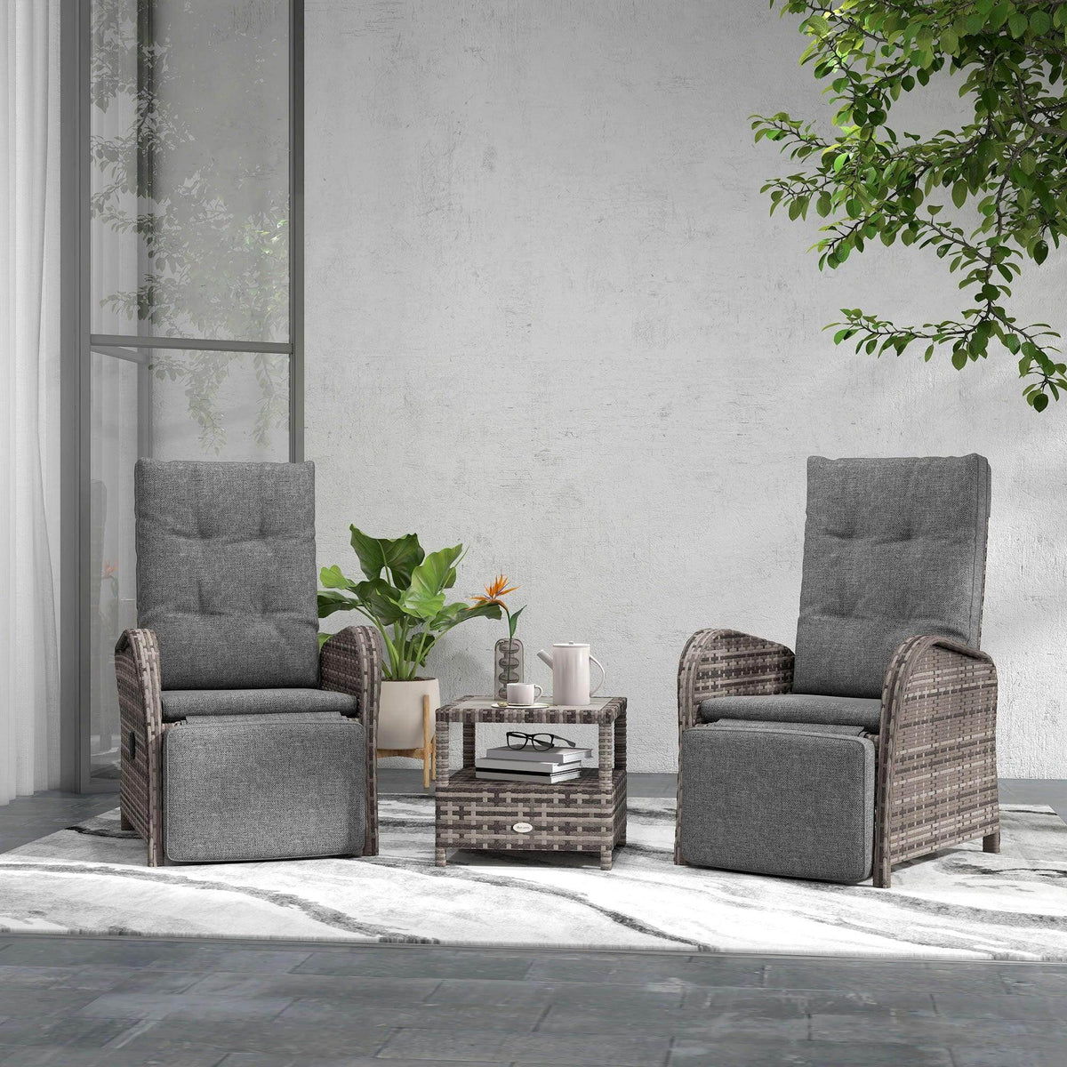 Patio rattan chaise lounge set with gray cushions and wicker armrests, two chairs
