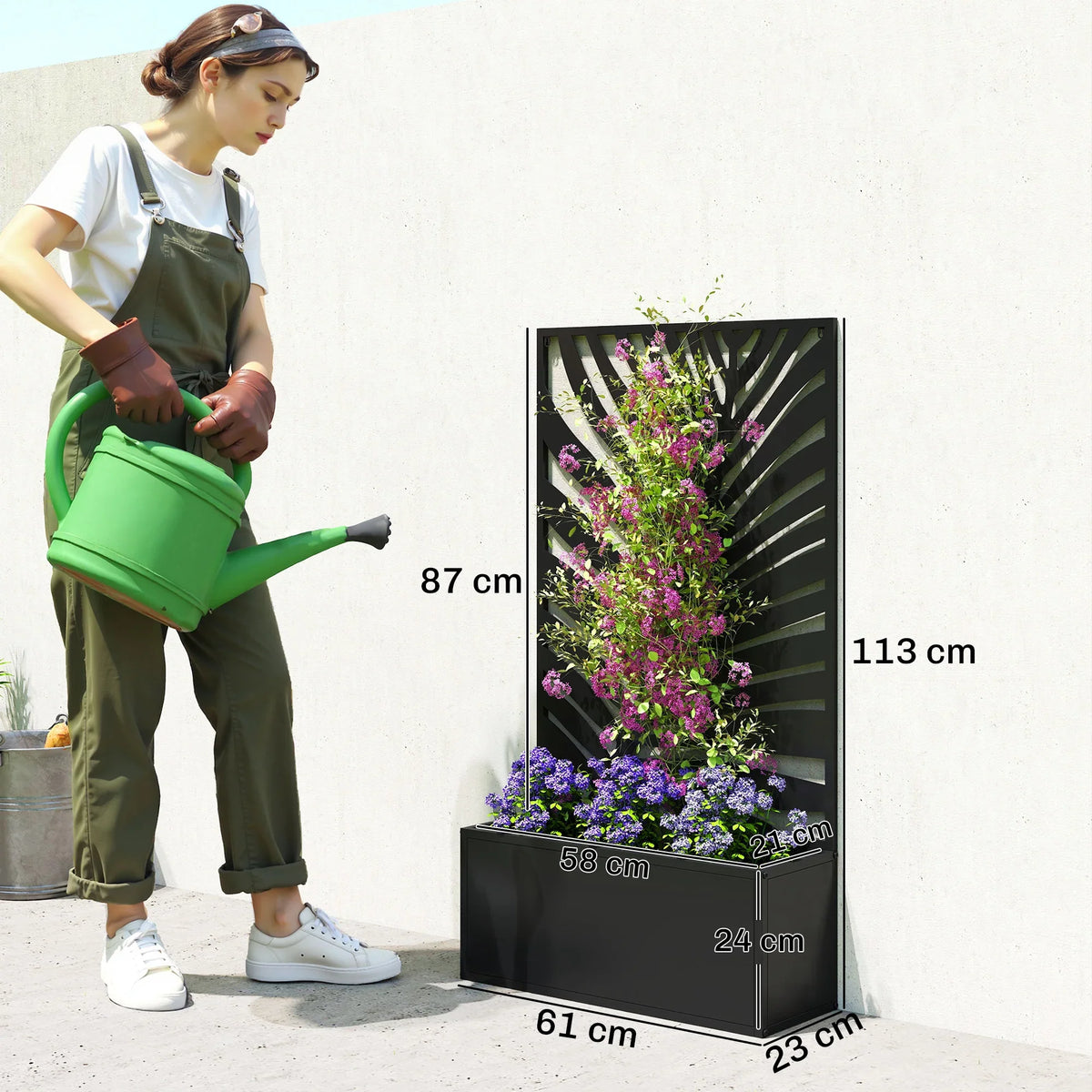 Black raised planter with trellis privacy screen next to person for scale